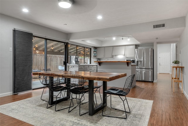 dining space featuring light hardwood / wood-style flooring