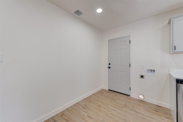 laundry area with light hardwood / wood-style floors, hookup for a washing machine, and electric dryer hookup