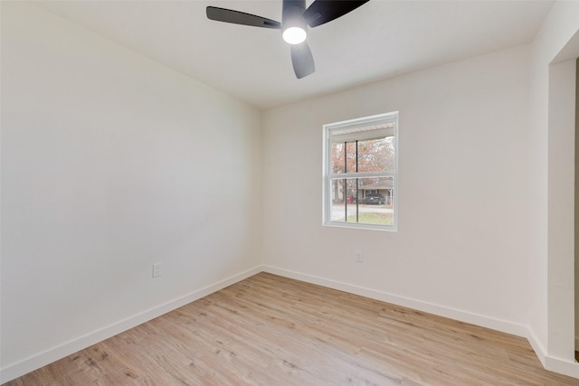 spare room with ceiling fan and light wood-type flooring