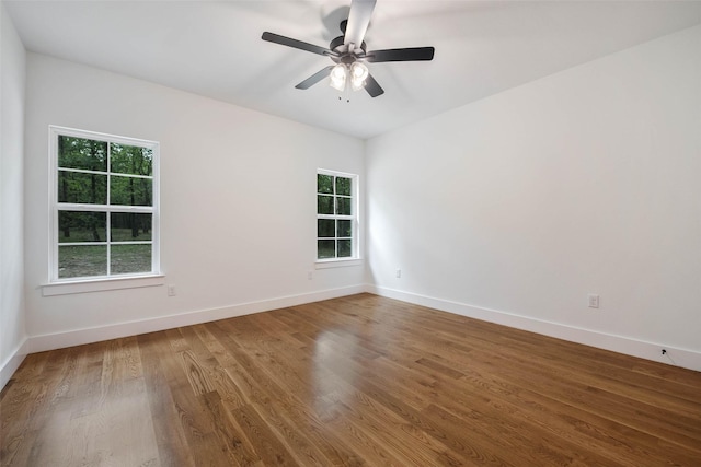 unfurnished room with hardwood / wood-style flooring and ceiling fan