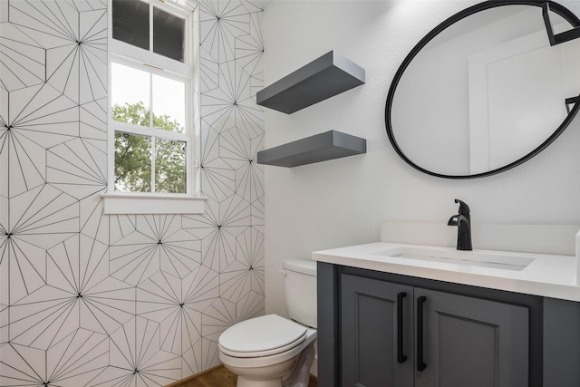 bathroom with vanity and toilet