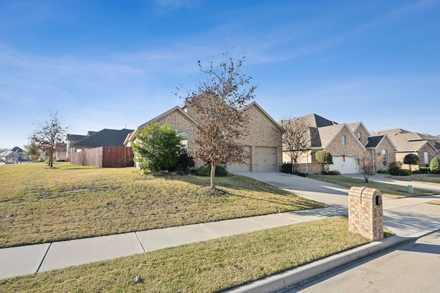 view of front property featuring a garage and a front lawn