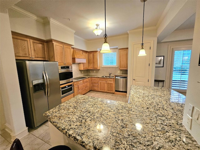 kitchen with decorative backsplash, ornamental molding, appliances with stainless steel finishes, decorative light fixtures, and light stone counters