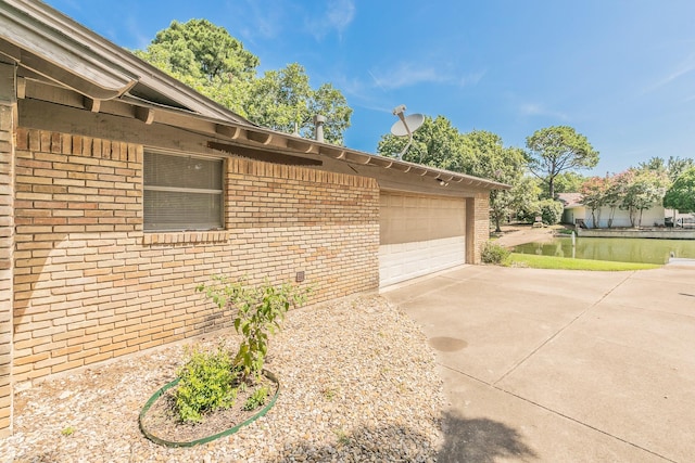 view of side of property with a garage