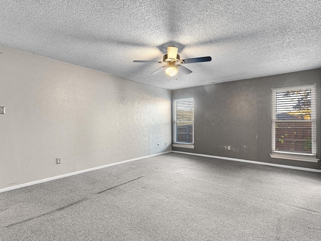 unfurnished room featuring carpet flooring, a textured ceiling, and ceiling fan