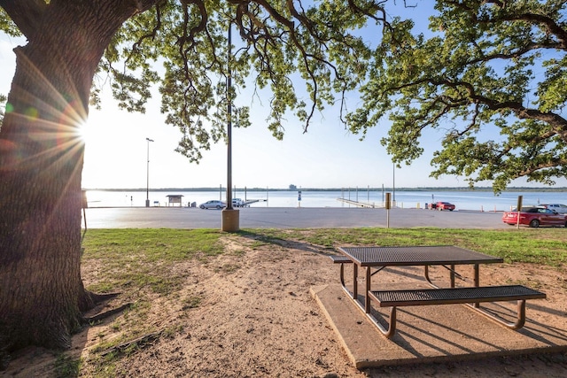 view of community with a water view