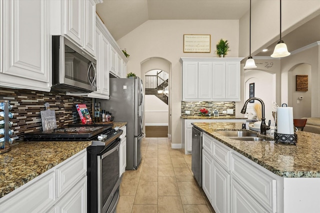 kitchen with pendant lighting, white cabinetry, sink, and stainless steel appliances