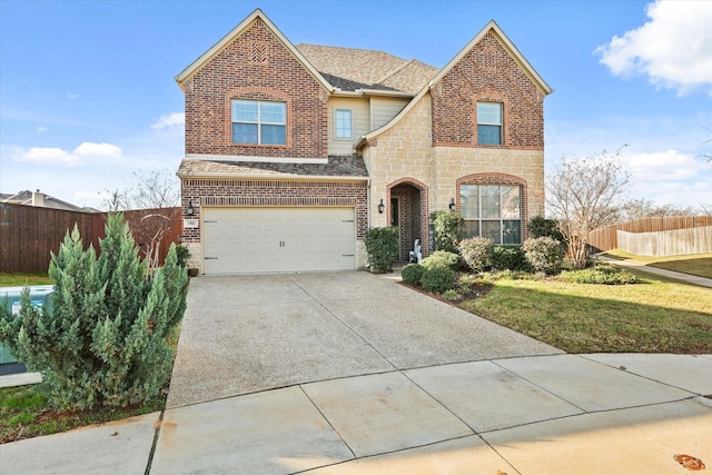 view of front of home featuring a front lawn and a garage