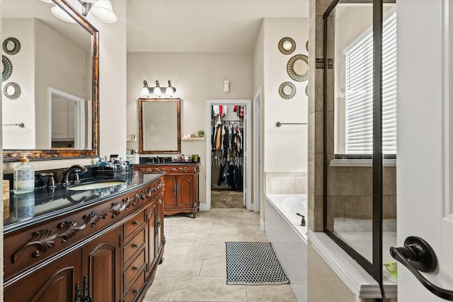 bathroom with separate shower and tub, tile patterned flooring, and vanity