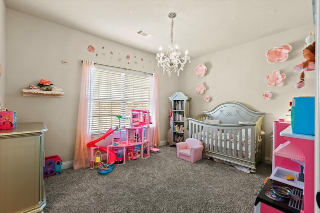 carpeted bedroom featuring a chandelier and a crib