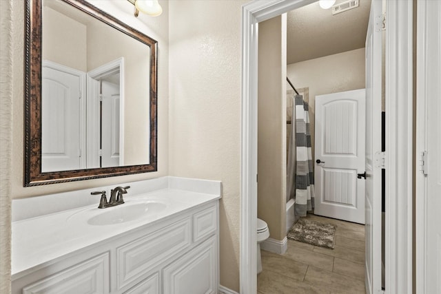 full bathroom with tile patterned flooring, vanity, shower / bath combination with curtain, and toilet