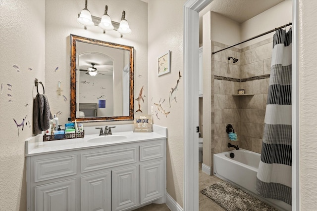 bathroom featuring tile patterned flooring, vanity, ceiling fan, and shower / bathtub combination with curtain