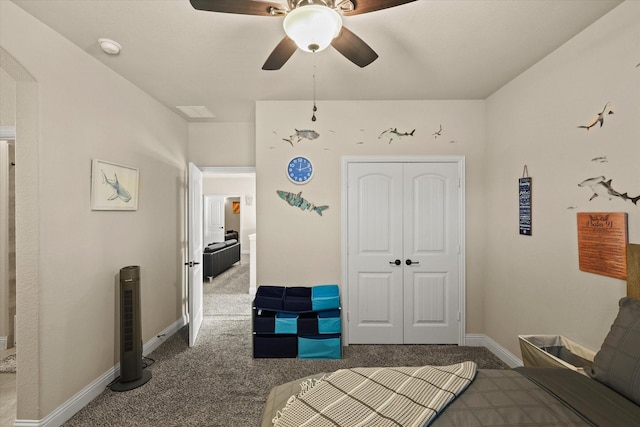 bedroom featuring carpet, ceiling fan, and a closet