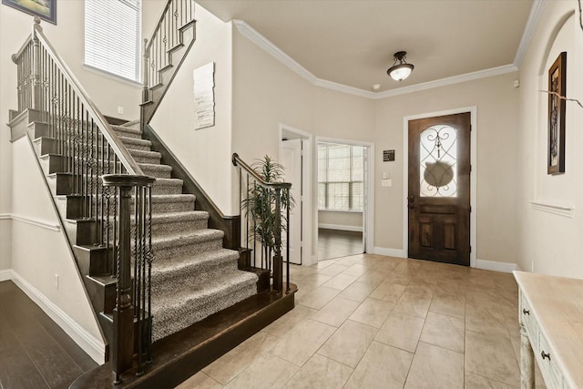 tiled foyer with ornamental molding