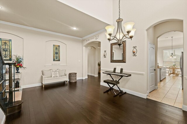 dining room featuring crown molding, a chandelier, and wood-type flooring