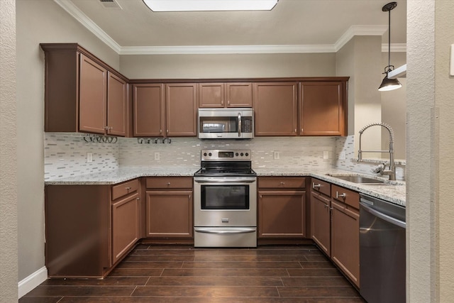 2204 Stonepark Pl, Mckinney, TX 75071 - kitchen with a sink, appliances with stainless steel finishes, ornamental molding, and dark wood-style flooring