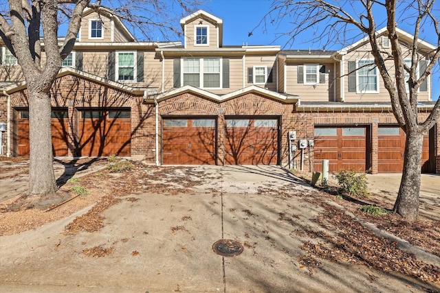 2204 Stonepark Pl, Mckinney, TX 75071 - townhome / multi-family property featuring an attached garage, concrete driveway, and brick siding