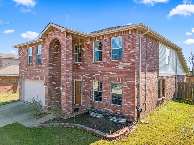 view of front of home with a garage and a front lawn