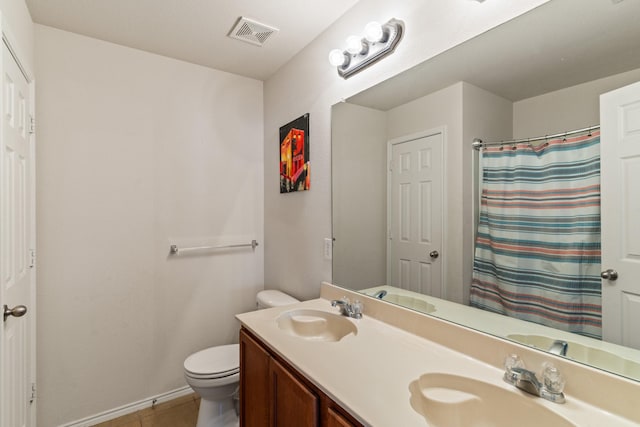 bathroom with tile patterned floors, vanity, toilet, and a shower with curtain