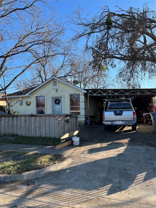 single story home featuring a carport