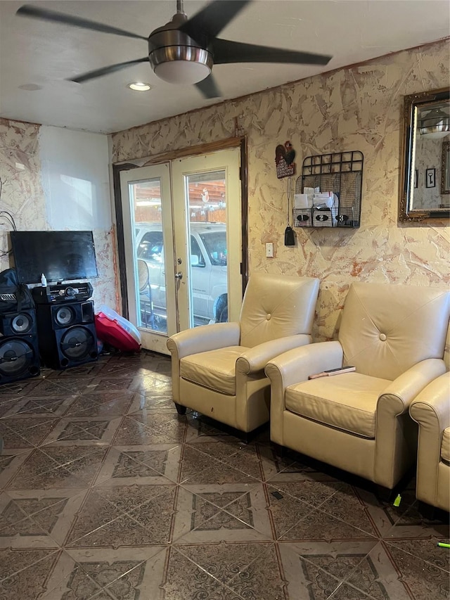 sitting room featuring ceiling fan