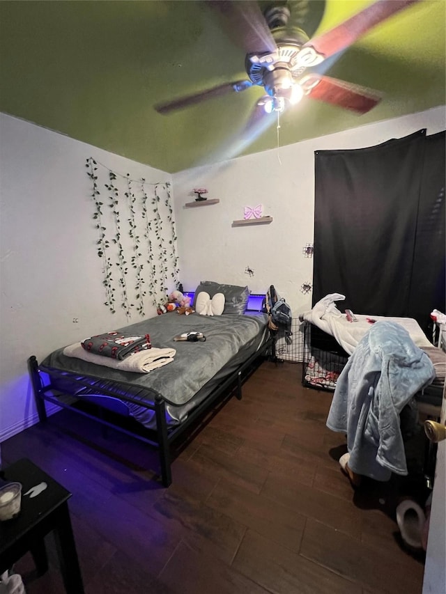 bedroom featuring ceiling fan and wood-type flooring