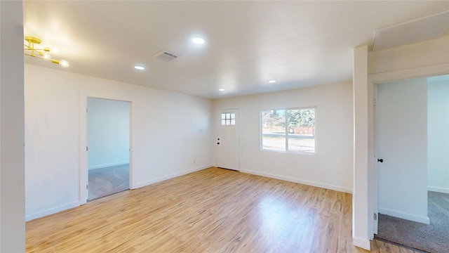 spare room with light wood-type flooring