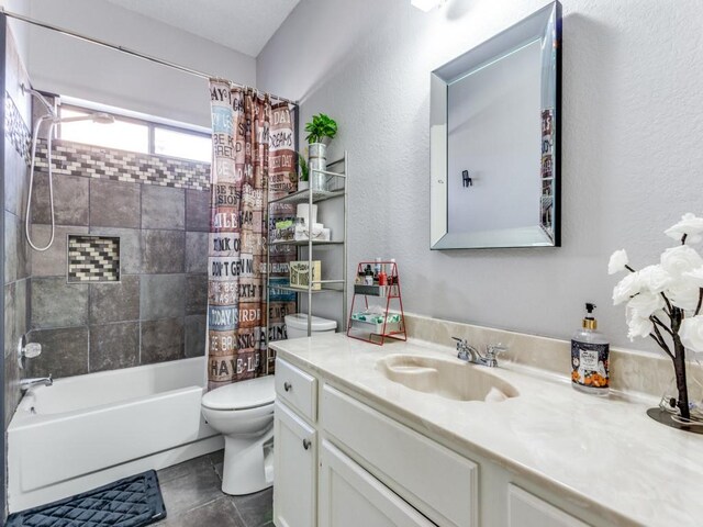 full bathroom with tile patterned flooring, shower / bath combination with curtain, toilet, and vanity