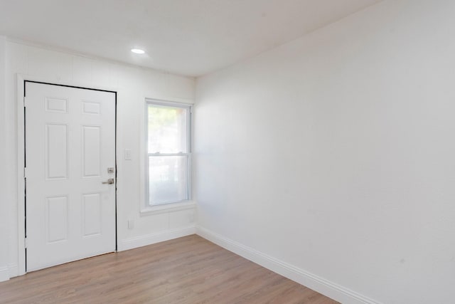 entryway featuring plenty of natural light and light hardwood / wood-style flooring