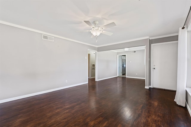 spare room with dark hardwood / wood-style flooring, crown molding, and ceiling fan