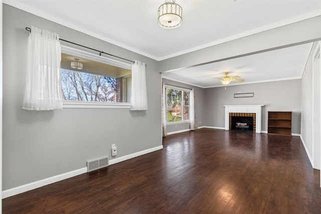 unfurnished living room with a fireplace, ornamental molding, dark hardwood / wood-style floors, and ceiling fan