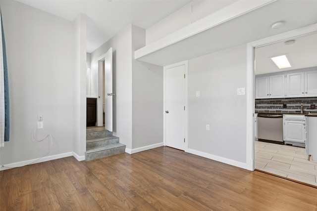 unfurnished living room featuring light hardwood / wood-style flooring