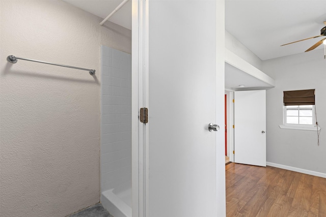 bathroom featuring hardwood / wood-style floors and ceiling fan