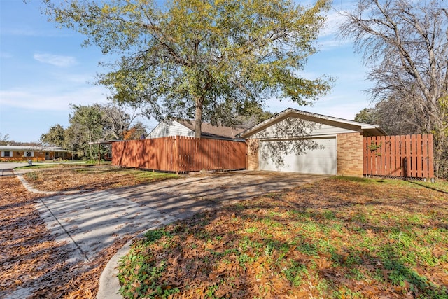 view of property exterior featuring a garage