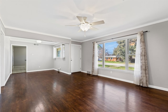 empty room featuring crown molding, dark hardwood / wood-style floors, and ceiling fan