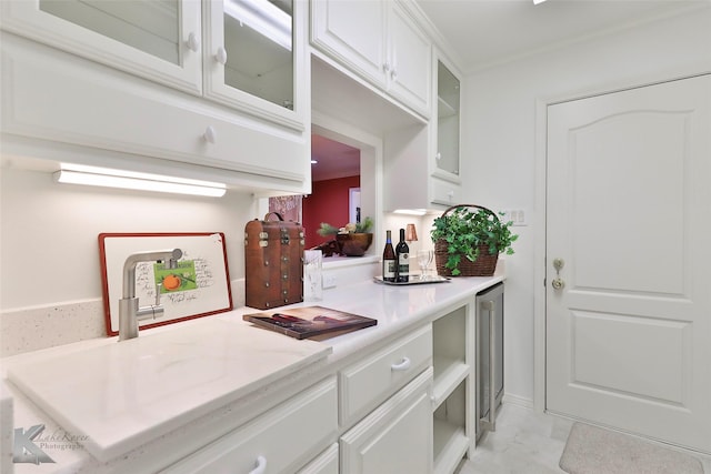 kitchen with white cabinetry and sink