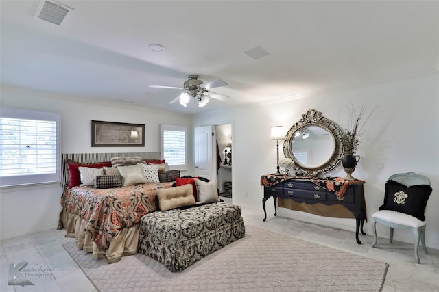 bedroom with ceiling fan and crown molding