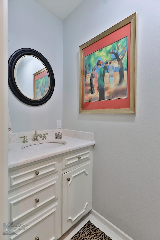 bathroom with tile patterned floors and vanity