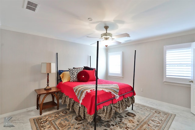 bedroom featuring ceiling fan and ornamental molding