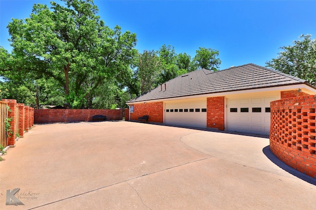 view of side of property featuring a garage