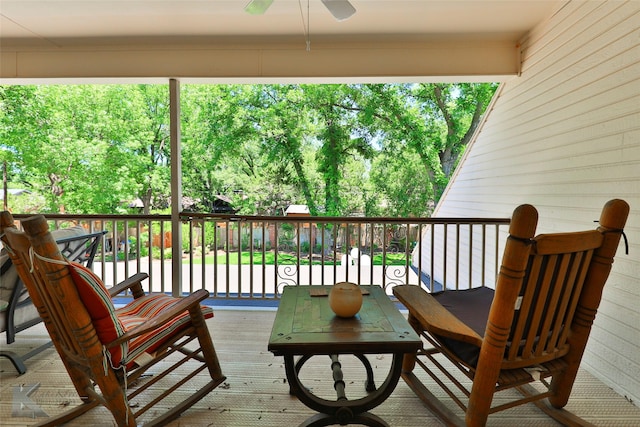 wooden deck with ceiling fan