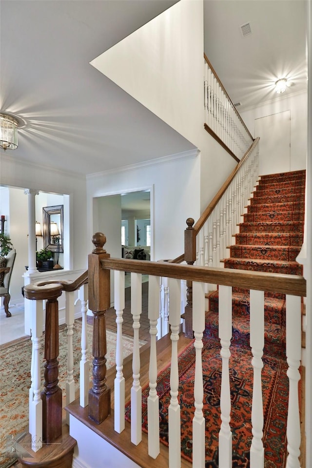 stairs featuring ornamental molding