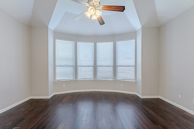 unfurnished room with ceiling fan, dark wood-type flooring, and lofted ceiling