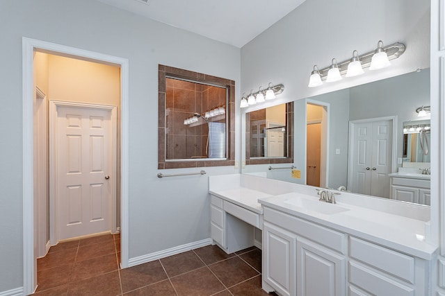 bathroom with tile patterned floors, vanity, and walk in shower