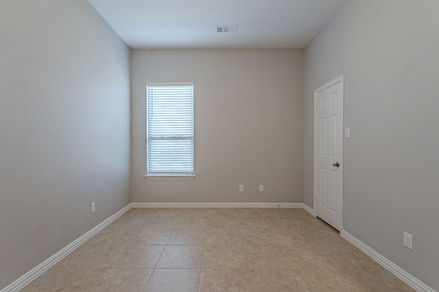 spare room with light tile patterned flooring