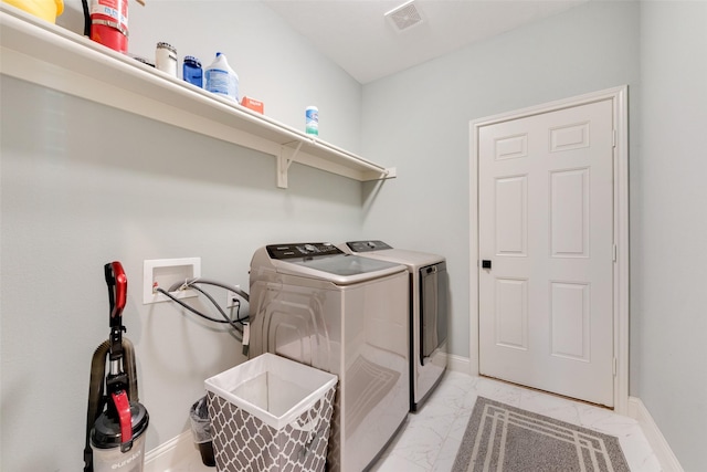 washroom featuring separate washer and dryer