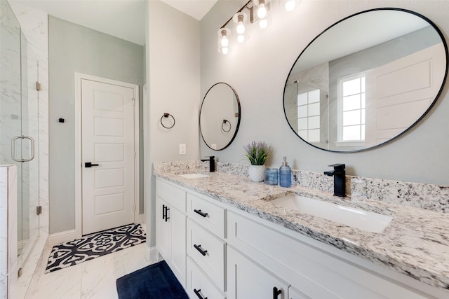 bathroom featuring vanity and an enclosed shower