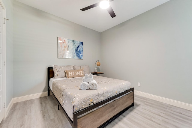 bedroom featuring wood-type flooring and ceiling fan