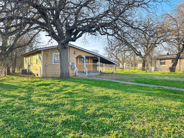 view of front of house featuring central AC unit and a front yard