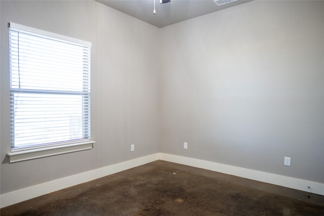 spare room with concrete floors